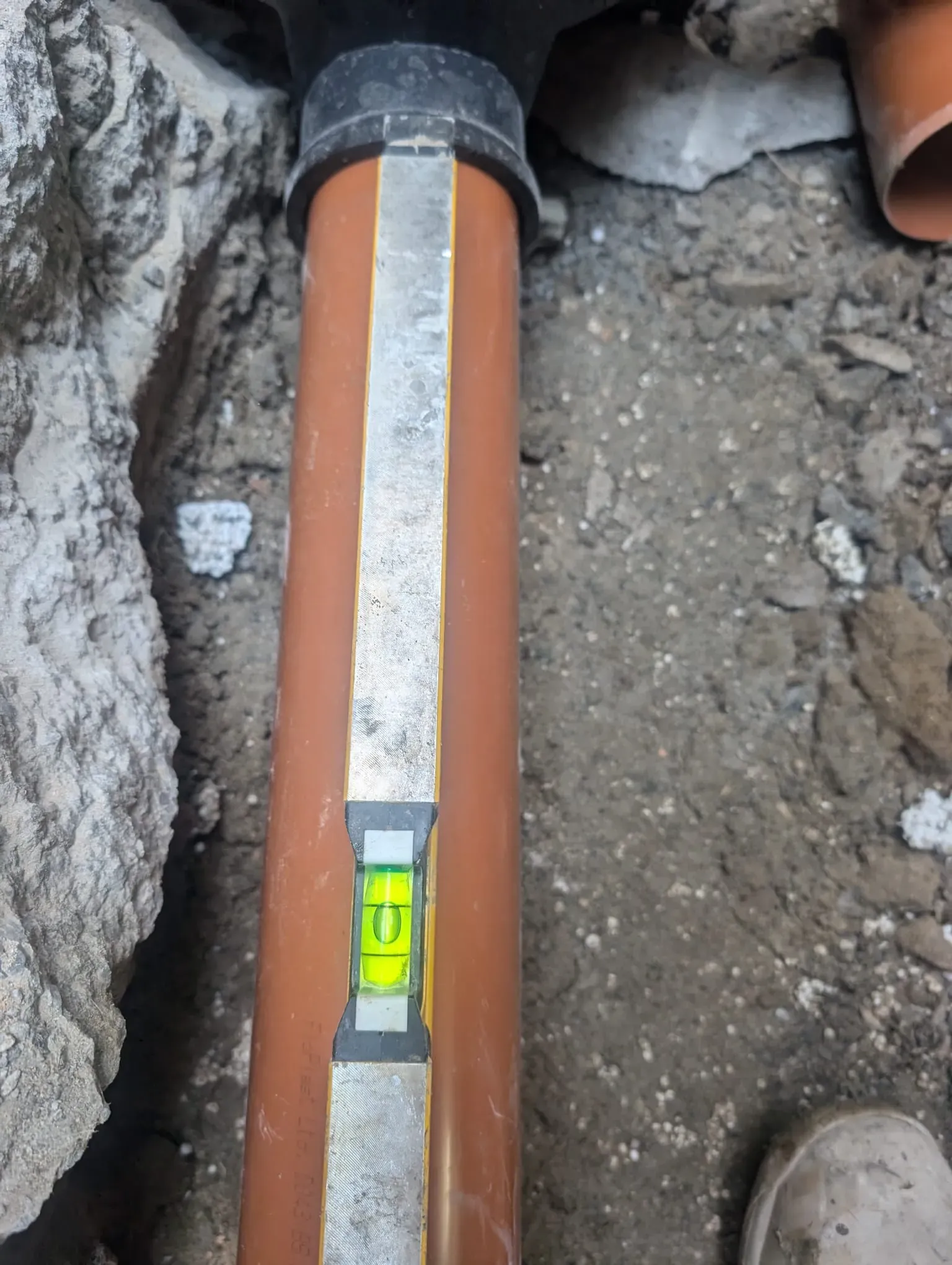 Installing a new drainage pipe.