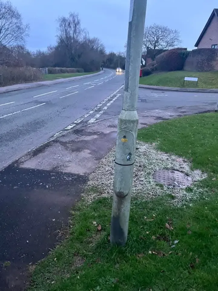 Outdoor manhole cover on grass verge